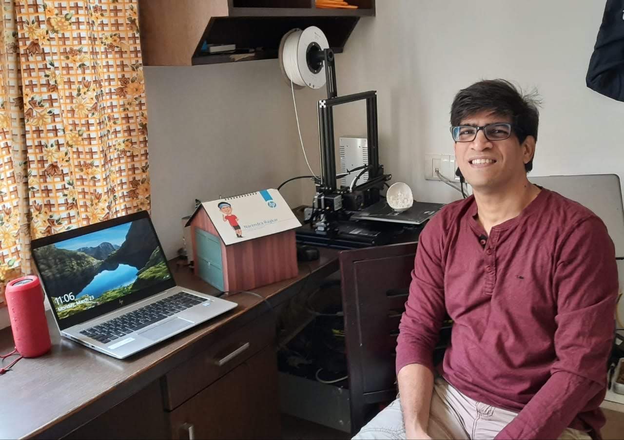 Naren Raykar seated in his home workspace